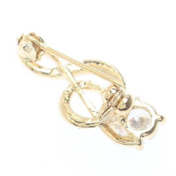 ゴールド・大きなストーンがついたト音記号のラペルブローチ・ラペルピン