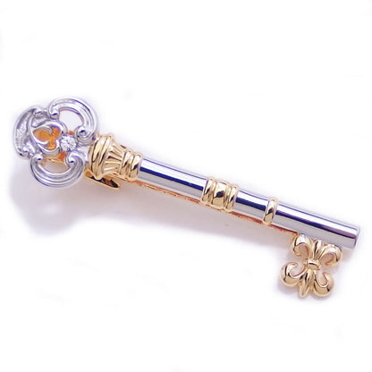 Two colors available, with a sparkling stone, a secret key motif tie pin